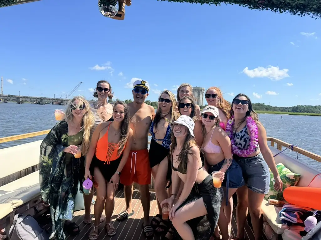 Charleston Party Boat Group on the Friki Tiki | Tiki Tours of Charleston Group celebrating on a party boat cruise with Tiki Tours of Charleston on Charleston Harbor