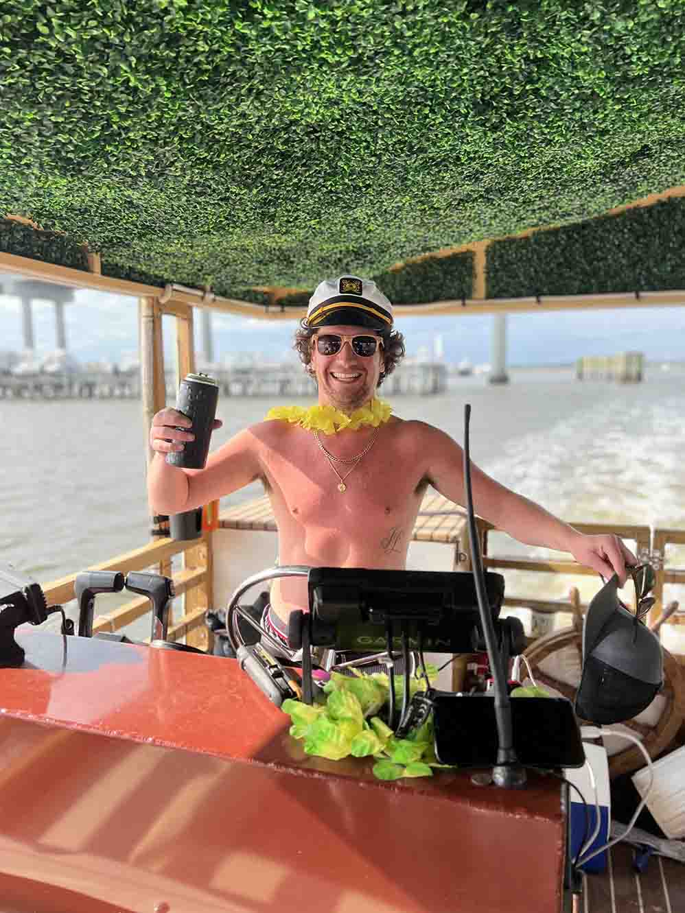 best-charleston-party-boat-experience A group of friends laughing and celebrating on the Friki Tiki party boat in Charleston Harbor.