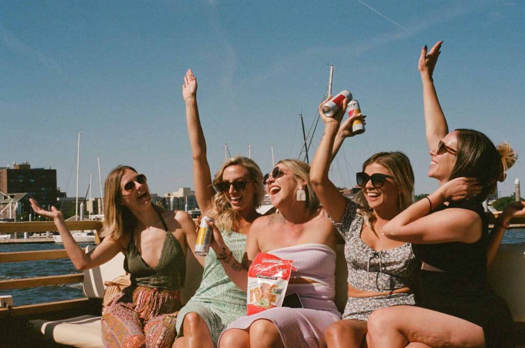 How-to-Plan-a-Party-Boat-in-Charleston (2) A happy group of friends celebrating a bachelorette party on the Friki Tiki boat in Charleston, South Carolina.