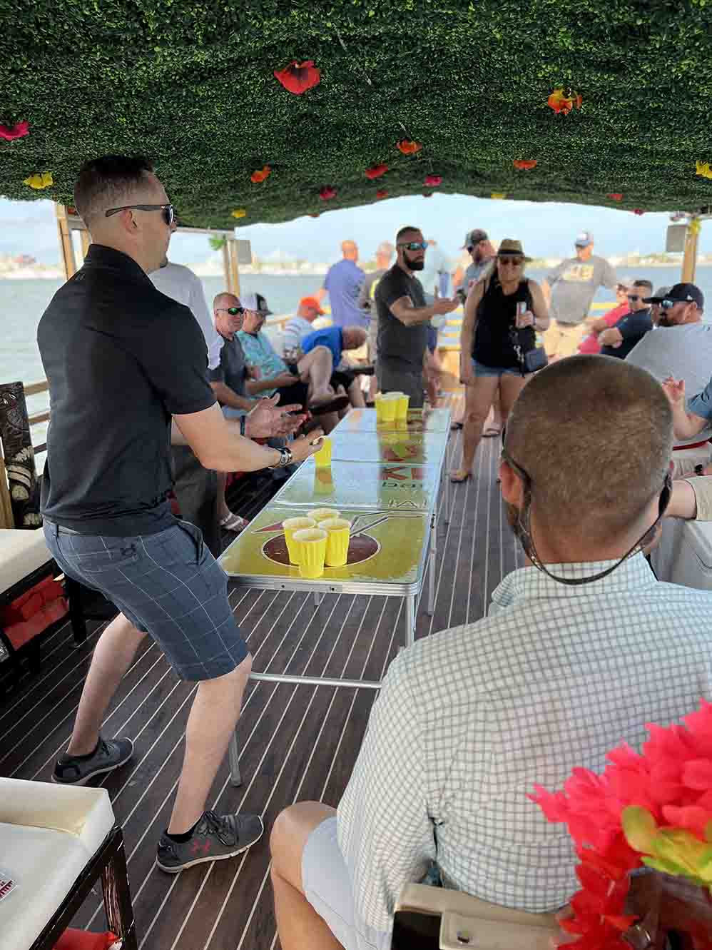 When-Are-Party-Boats-Available (1) Excited passengers cheering on the Friki Tiki party boat during a Charleston harbor cruise.