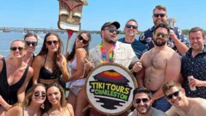 A group of passengers enjoying a stress-free experience thanks to effortless boat party organization on the Friki Tiki in Charleston Harbor.