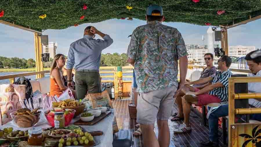 What-Is-the-Best-Party-Boat (4) A view looking forward over the shoulder of a licensed and certified USCG Captain at the helm of a Charleston Harbor party boat, the Friki Tiki, ensuring a safe cruise.